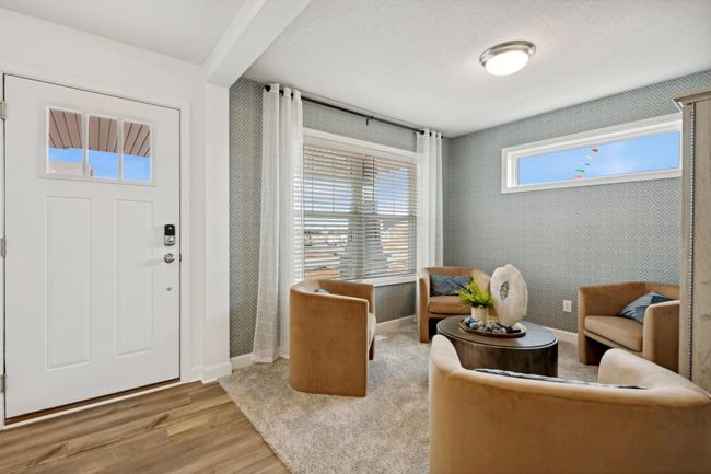 (Photo of decorated model, actual home's finishes may vary slightly) A spacious flex room is located at the foyer offering a nice work from home space, or a formal living room area. | Image 7