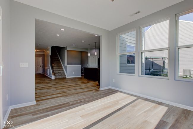spare room featuring stairs, light wood-style floors, and recessed lighting | Image 25