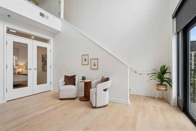 This additional lounge space near the main-level primary bedroom offers quiet comfort for relaxing, reading, or winding down. | Image 13
