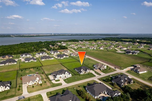 Aerial view of property and surrounding area featuring nearby suburban area, a nearby body of water, and a notable bridge | Image 32