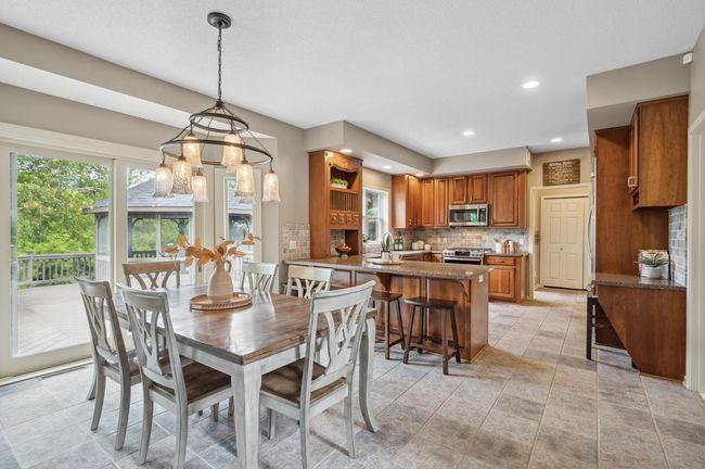 Informal dining area to kitchen which leads to garage - easy to unload the groceries! | Image 9