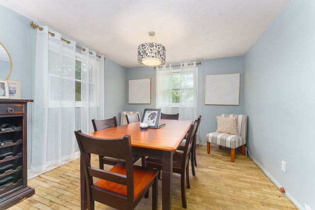 FORMAL DINING ROOM OFFERS NATURAL WOOD FLOORING | Image 7