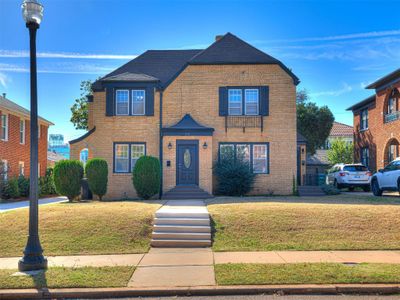 View of property with a front lawn | Image 1