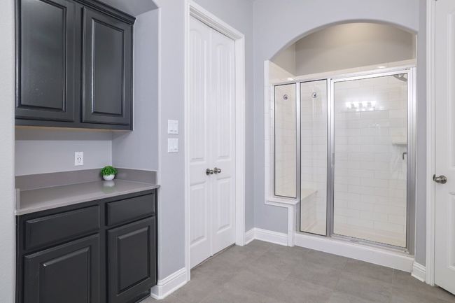 Bathroom with a shower stall and baseboards | Image 19