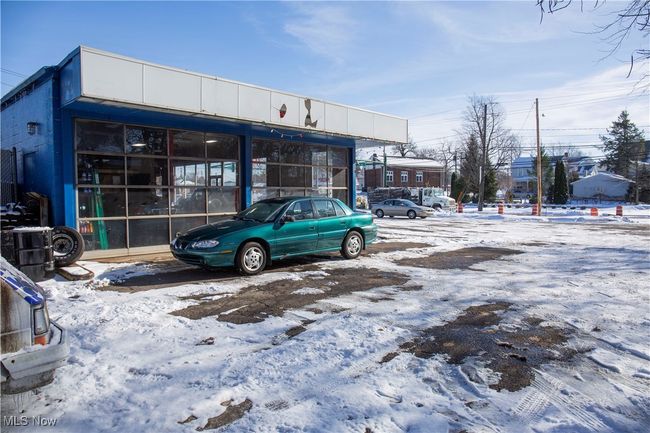 View of snow covered parking area | Image 8