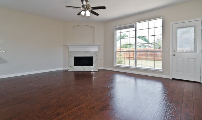 Downstairs Family Room Features A Cozy Fireplace With Polished Ceramic Tile Surround! | Image 9