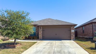 View of front facade featuring a garage | Image 1