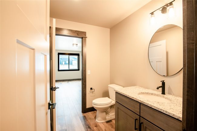 Bathroom with hardwood / wood-style flooring, vanity, and toilet | Image 31