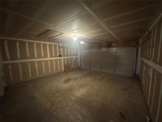 Garage featuring a garage door opener | Image 12