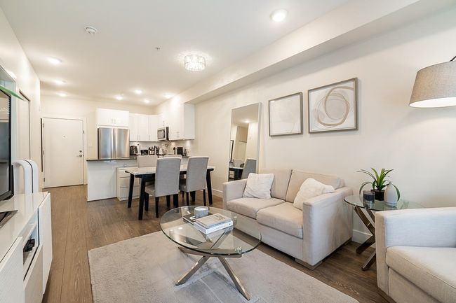 Living area with recessed lighting and dark wood-style floors | Image 9
