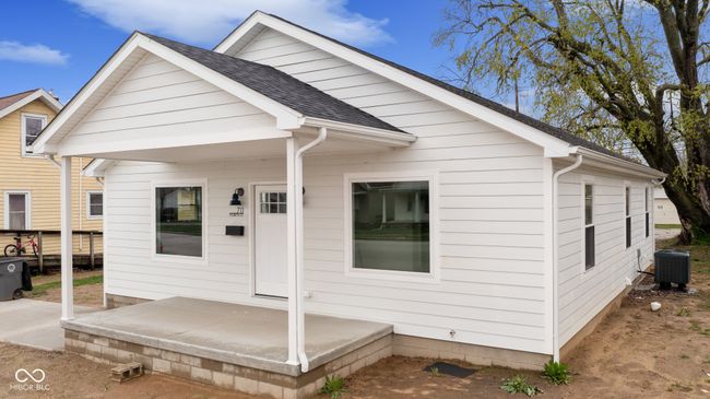 view of front of home featuring a patio area, a shingled roof, and cooling unit | Image 5