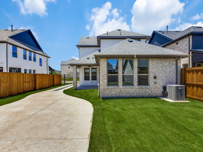 The entire family will enjoy plenty of fun outdoor gatherings in this lovely fenced back yard with covered patio. | Image 16