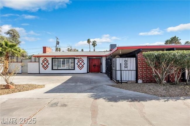 View of front of property featuring a fenced front yard, driveway, a gate, and cooling unit | Image 30