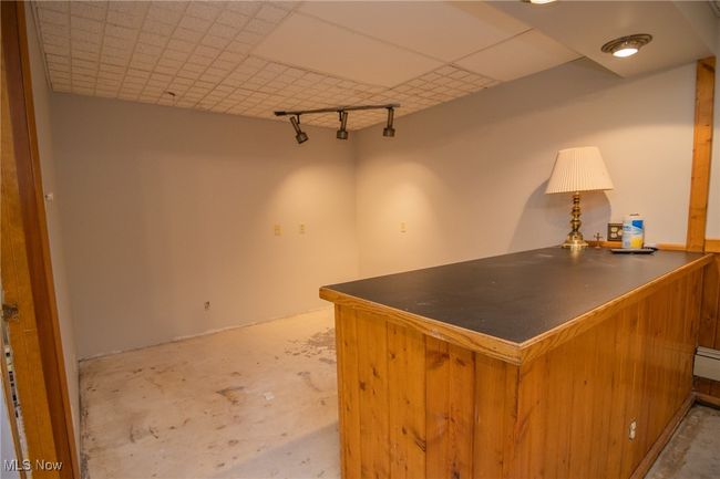 Office space featuring a bar and concrete flooring | Image 12