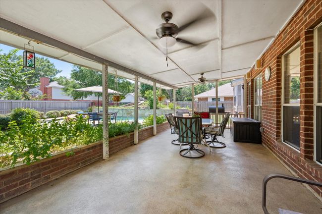 Another view of this covered patio space. Enjoy backyard BBQs in this wonderful entertaining backyard retreat. | Image 16