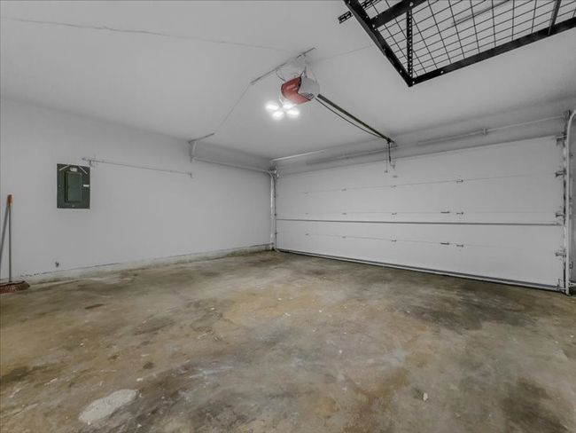 Garage with a garage door opener and electric panel | Image 29