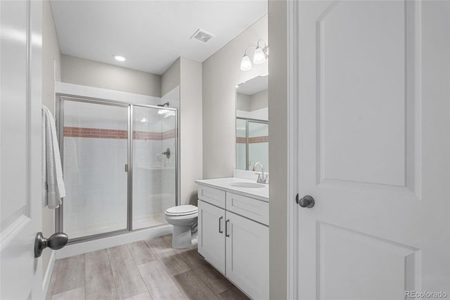Basement bathroom with beautiful tiled shower | Image 41