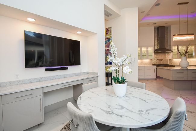 Breakfast nook features built in cabinetry & desk area. | Image 21