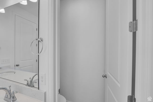 Bathroom featuring toilet and vanity | Image 28