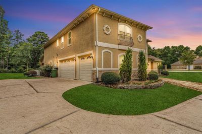 The circular driveway provides additional parking along with the attached 3 car garage | Image 2