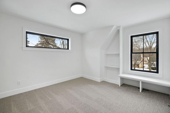 2 additional bedrooms and loft feature custom bookshelves and benches. Pictures of previously built house. | Image 21