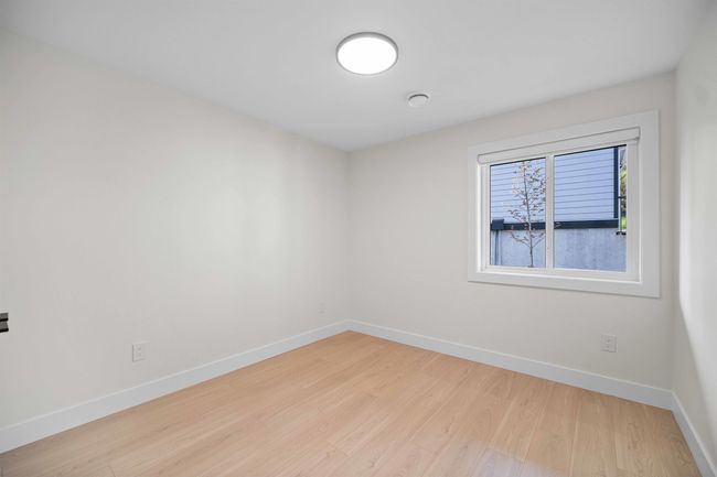 Empty room with baseboards and light wood-style floors | Image 26