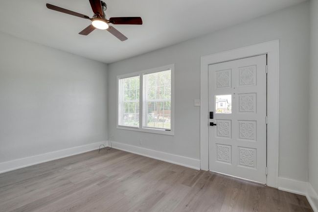 Entrance foyer featuring light wood finished floors and a ceiling fan | Image 6
