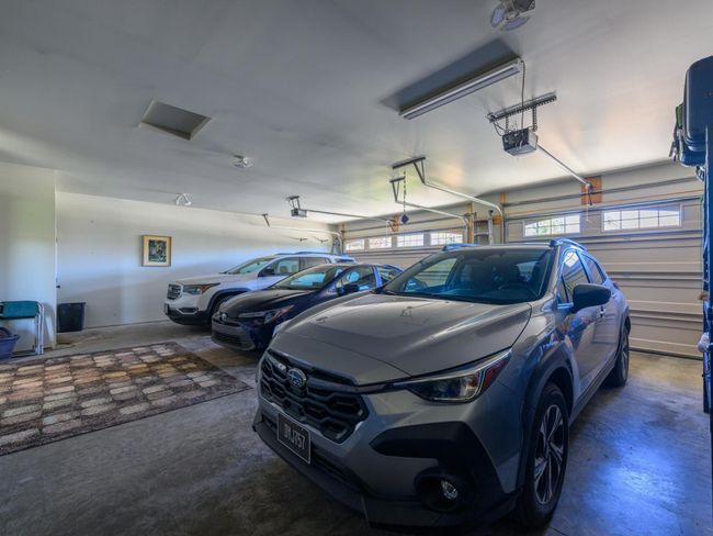 Garage featuring a garage door opener | Image 30
