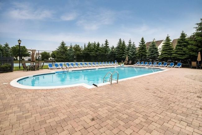 Pool with fence and a patio area | Image 40