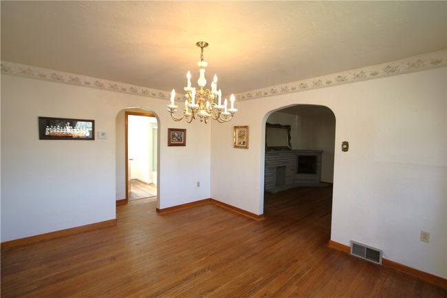 Attractive Stone Decorative Fireplace in Large Living Room | Image 13
