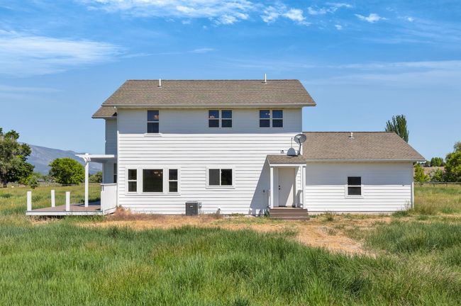Rear view of property featuring a mountain view | Image 54