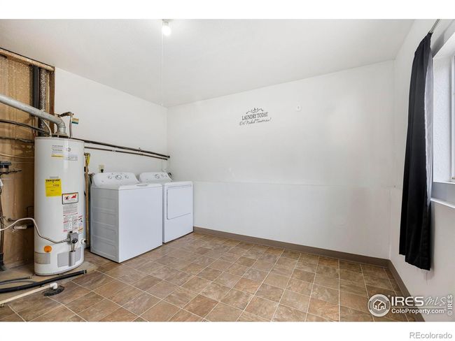 Bright, spacious utility/laundry/storage room. | Image 31