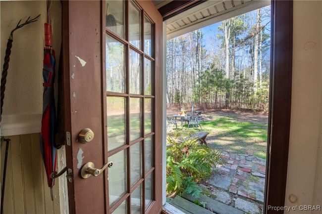 Entryway out to partially fenced yard | Image 17