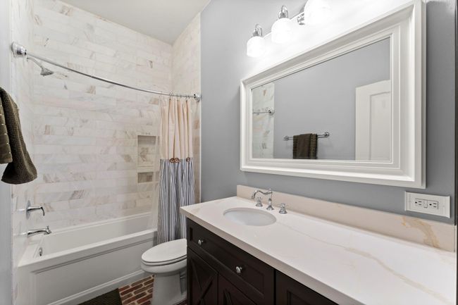 Secondary full bath with updated large bathtub and shower. | Image 20