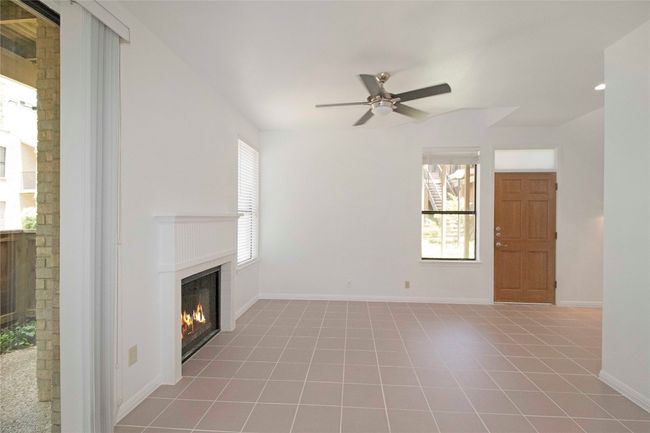 Living and Dining Combo with Sliding door to Private downstairs courtyard and WBFP. | Image 21