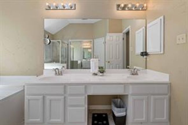 Bathroom featuring double vanity and a sink | Image 26