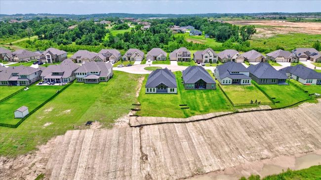 A closer look at the spacious backyards and covered patios that make entertaining and relaxing a breeze. These homes in Waterstone offer serene surroundings with plenty of room to create your ideal outdoor space. | Image 48