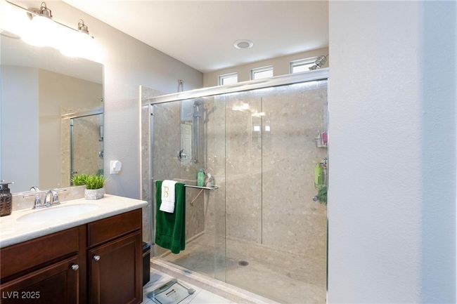 Full bath featuring a shower stall and vanity | Image 25