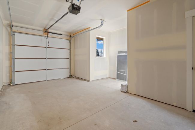 Garage with a garage door opener | Image 26