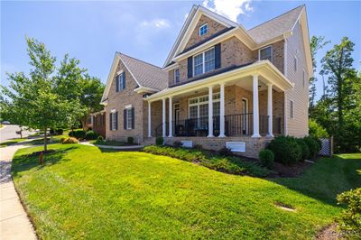 View of front facade featuring a front lawn and a porch | Image 2