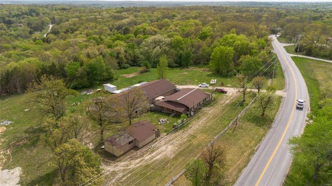 Bird's eye view featuring a forest view | Image 10