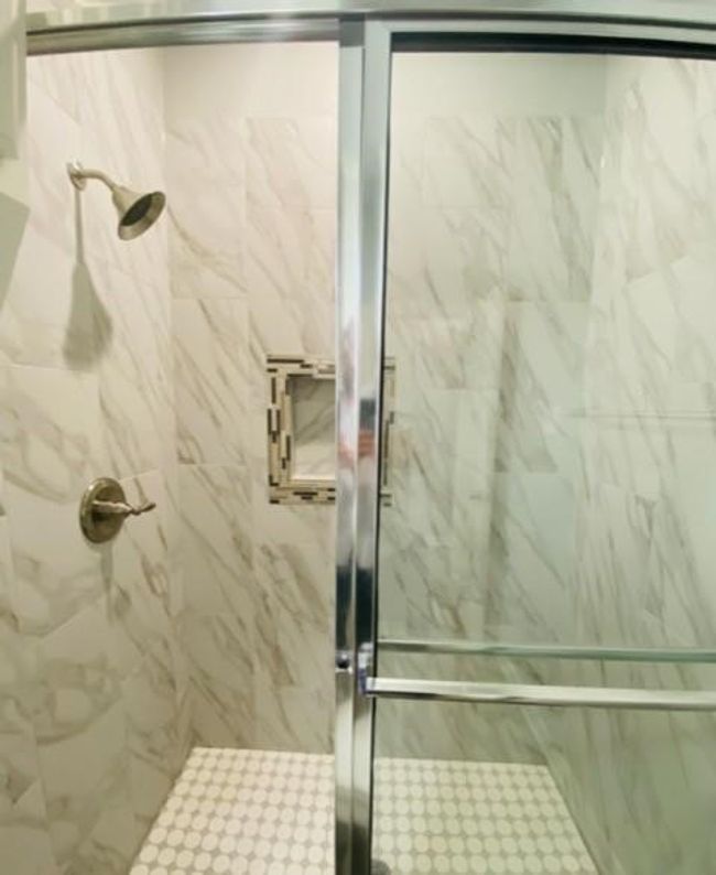 Full bathroom featuring a marble finish shower | Image 9