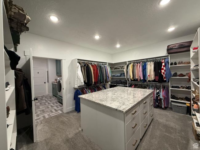 Spacious closet featuring light carpet and separate washer and dryer | Image 43