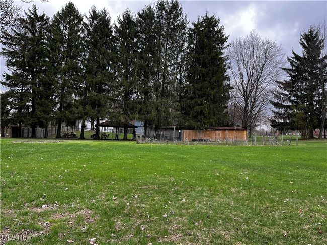 View of yard featuring fence | Image 26