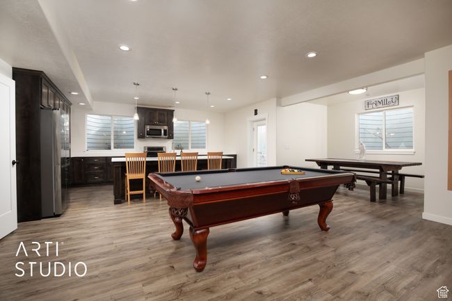Game room featuring a wealth of natural light, light wood-type flooring, and billiards | Image 30