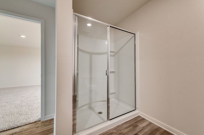 Bathroom featuring wood-type flooring and an enclosed shower | Image 6