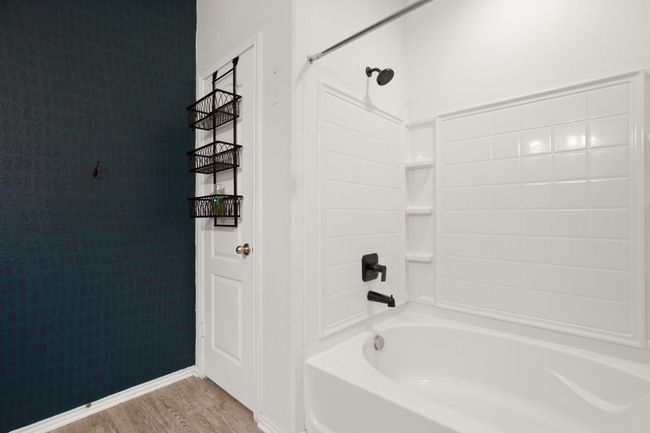 Bathroom with shower combination and wood finished floors | Image 14
