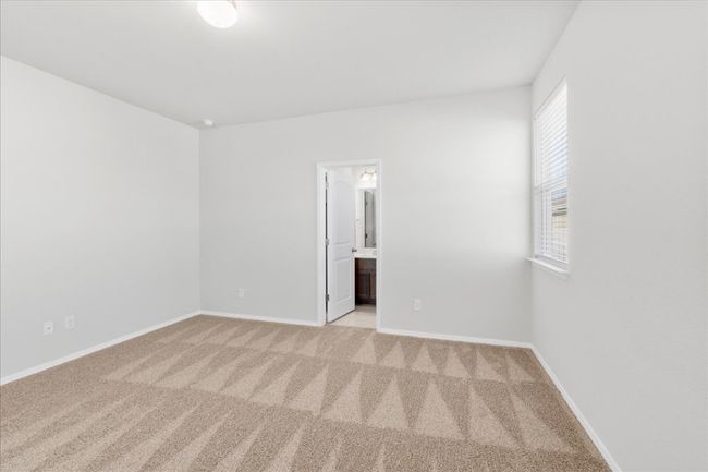 Spare room with baseboards and carpet | Image 15