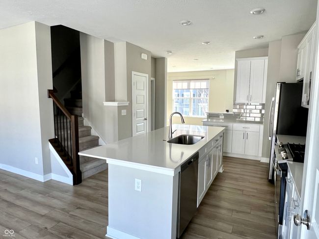 Kitchen and stairs to upper level bedrooms | Image 30