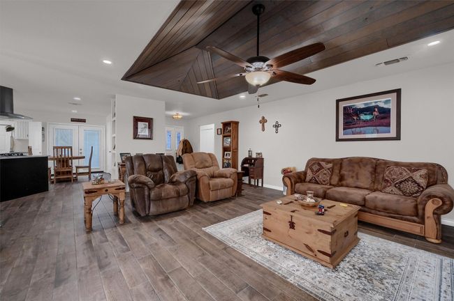 Living room with recessed lighting, wood finished floors, and a ceiling fan | Image 4